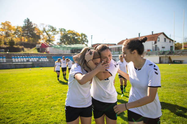 istock Female soccer team celebrating victory 1201684303