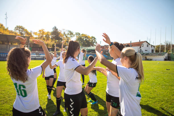 istock Female soccer team celebrating victory 1201684369