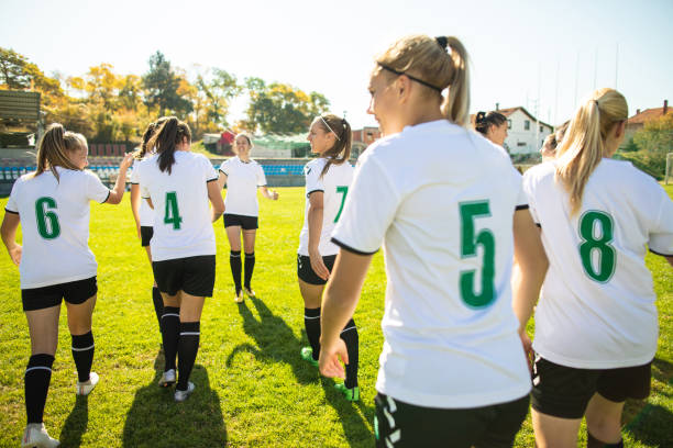 istock Female soccer team celebrating victory 1201685020