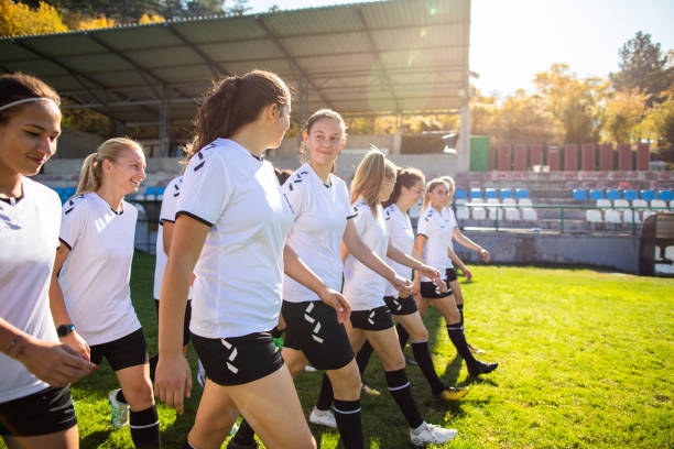 istock Woman soccer team walking on training grounds 1201685147