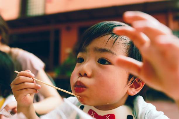 istock Little boy eating watermelon 1201685408