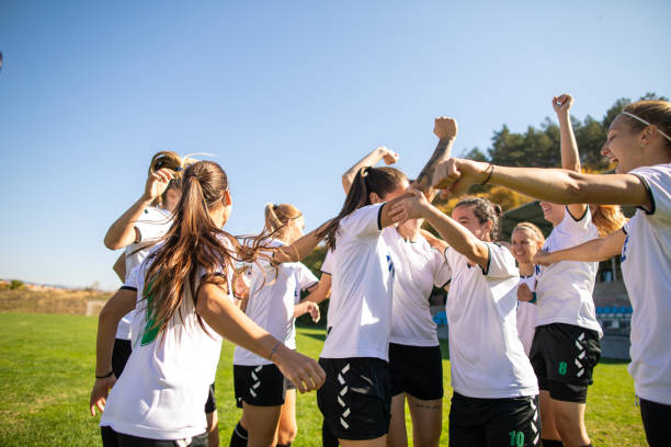 istock Female soccer team celebrating awesome victory 1201685456