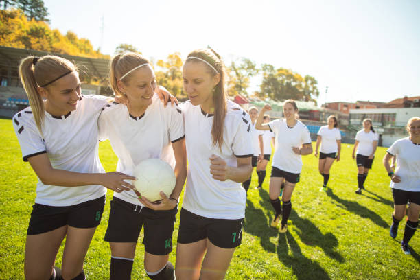 istock Female soccer team celebrating victory 1201685498