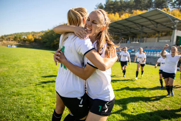 istock Female soccer team celebrating a victory 1201685512