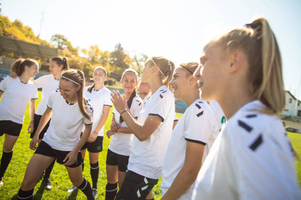 istock Female soccer team celebrating victory 1201685566
