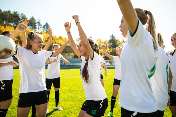 istock Female soccer team celebrating victory 1201685589