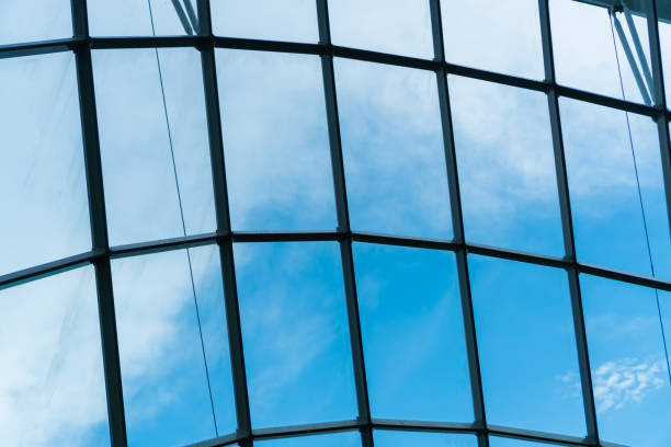 istock looking at the cloudy blue sky through the large windows 1201693380
