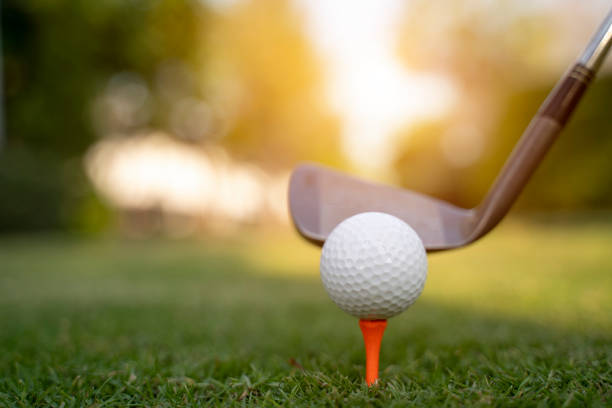 istock Teeing off with golf club and golf ball 1201693539
