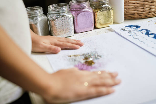 istock Containers with different colour of glitter for creating art work 1201695962