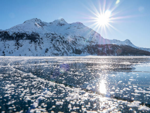 istock Frozen lake and snowcapped mountain in Switzerland 1201699559