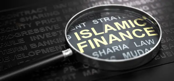 3D illustration of a magnifier over the text Islamic finance written with golden letter. Black background.