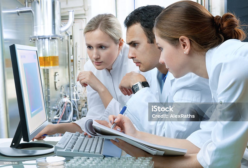 laboratory group of scientists working at the laboratory. Laboratory Stock Photo