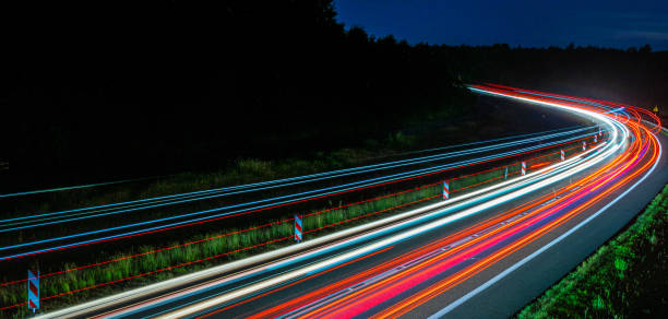 istock lights of cars with night 1201702437