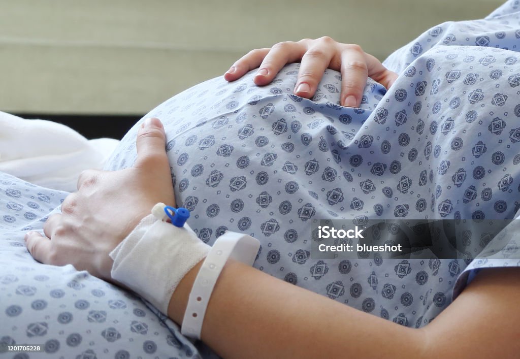 Newborn baby and pregnancy First moments with the baby and the excitement of being a family or parents Pregnant Stock Photo