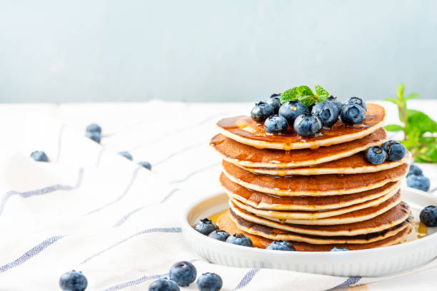 istock Pancakes with maple syrup and blueberries 1201706712