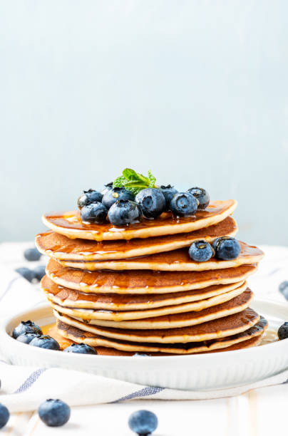 istock Pancakes with maple syrup and blueberries 1201707034