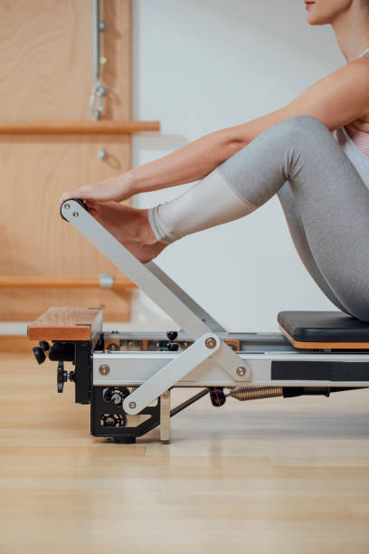 istock Sportswoman Doing Exercise on Pilates Reformer 1201708186