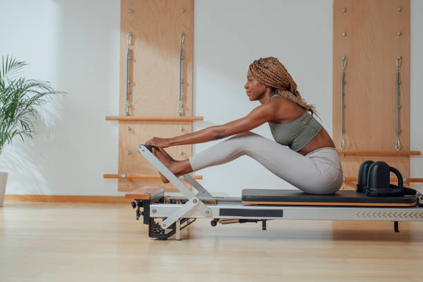 istock Woman Doing Pilates Exercise on Reformer 1201708210