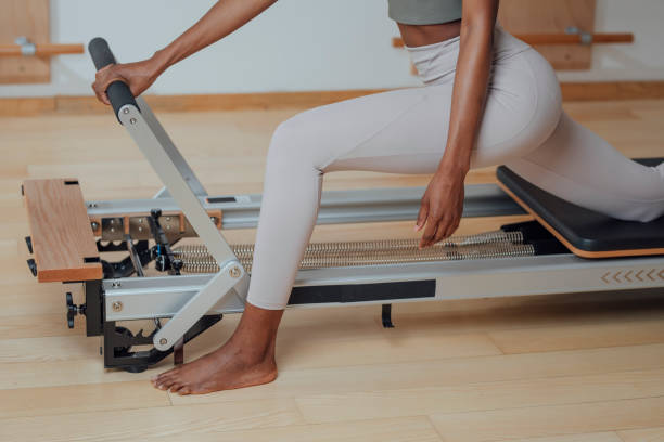 istock Woman Doing Pilates Exercise on Reformer 1201708214