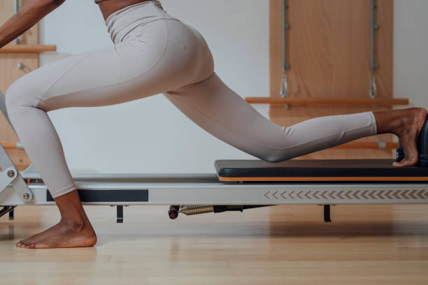 istock Woman Doing Pilates Exercise on Reformer 1201708215