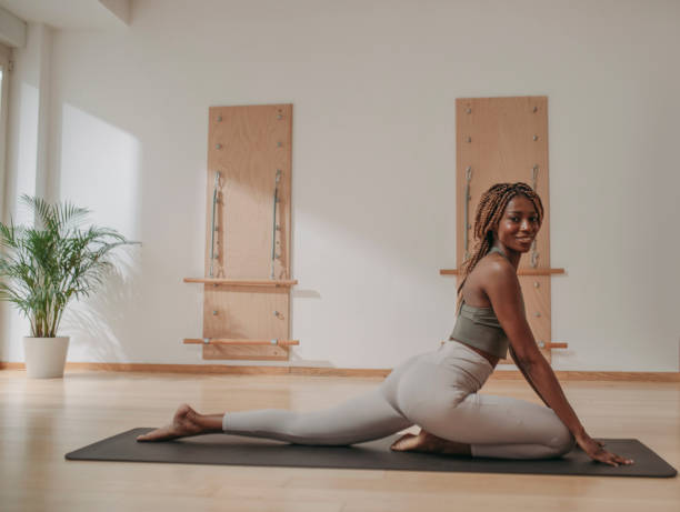 istock Woman in Sportswear Doing Pilates Exercise 1201708309