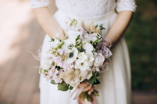 istock wedding bouquet in hands of bride 1201709097