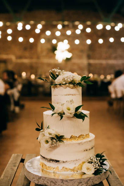 istock wedding cake with flowers  at a restaurant 1201709099