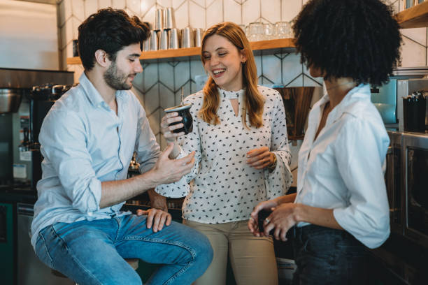 istock Three people having a coffee break at the office. They are drinking yerba mate together. 1201710304