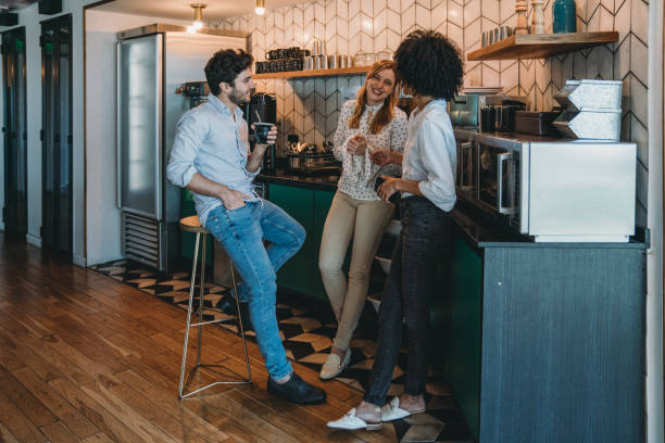 istock Three people having a coffee break at the office. They are drinking yerba mate together. 1201710325