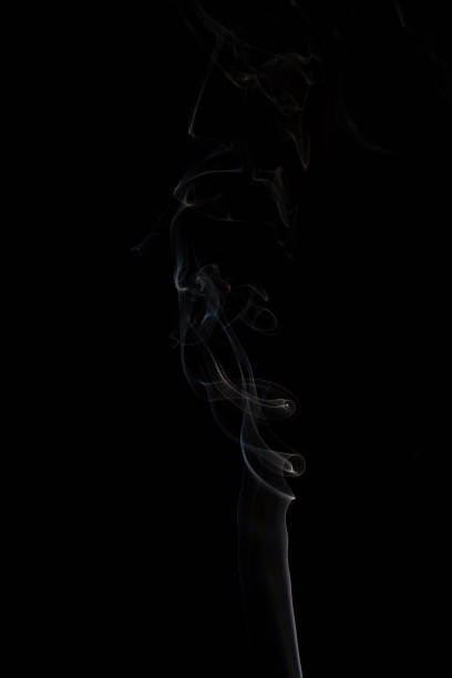 istock Smoke from incense isolated on black background 1201711648