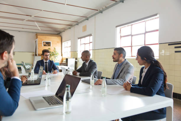 istock Group of thoughtful marketing experts during morning briefing 1201711718