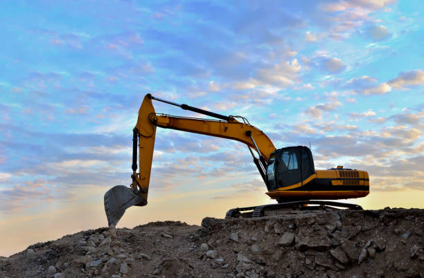 istock Excavator loads of stone and rubble for processing into cement or concrete for construction work and reuse 1201713177