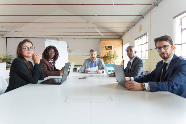 istock Group of serious managers during morning briefing 1201713796