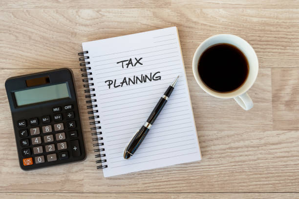 Tax Planning text on Note pad Business finance Concept - Tax Planning text on Note pad tax form photos stock pictures, royalty-free photos & images