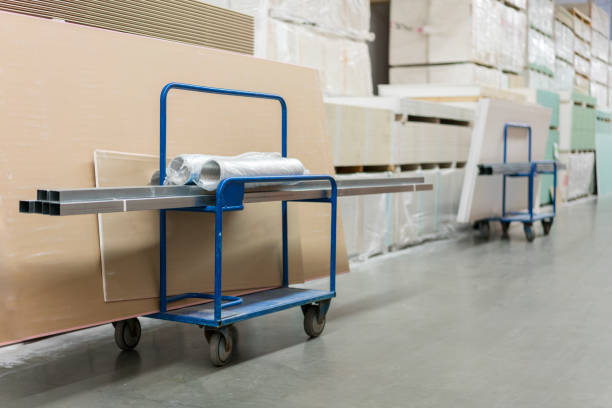 istock Trolley in a hardware store loaded with construction materials. Repair and construction concept 1201715679