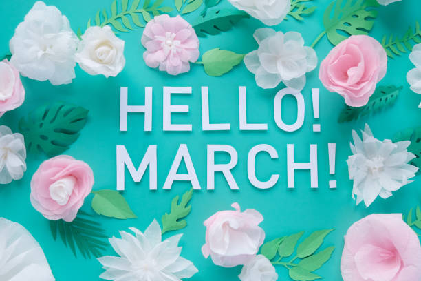 istock Hello, march. With white and rose paper flowers 1201716021