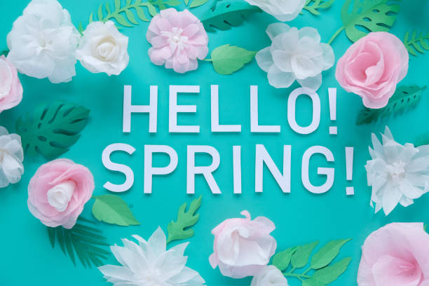 istock Hello, spring With white and rose paper flowers 1201716022