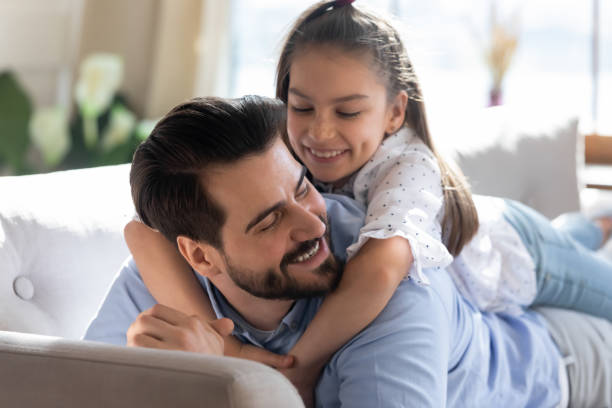 istock Little daughter have fun enjoy weekend with dad at home 1201717130
