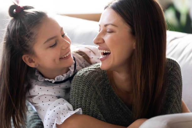 istock Young Caucasian mum rest at home with small daughter 1201717146