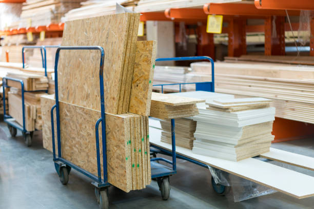 istock Trolley in a hardware store loaded with construction materials. Repair and construction concept 1201717324