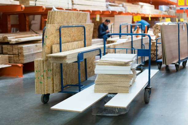 istock Trolley in a hardware store loaded with construction materials. Repair and construction concept 1201717691