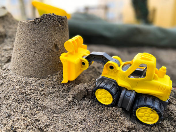 istock toys in the sand 1201717692