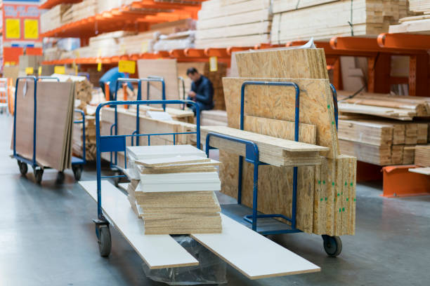 istock Trolley in a hardware store loaded with construction materials. Repair and construction concept 1201717715