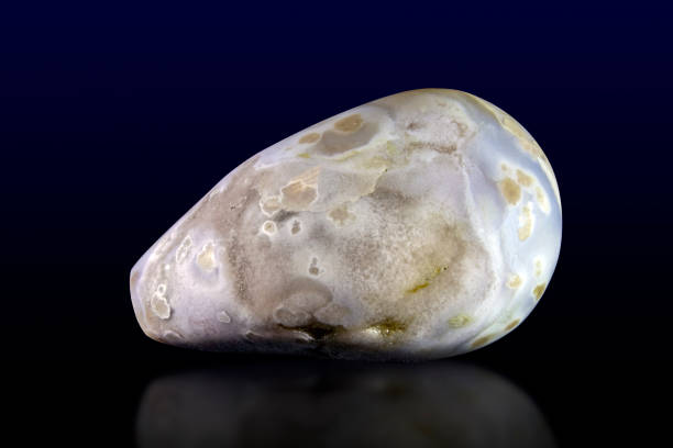 istock Beautiful blue agate gemstone on dark background 1201722045