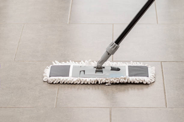 istock Cleaning gear mopping a living room floor with tile 1201723208