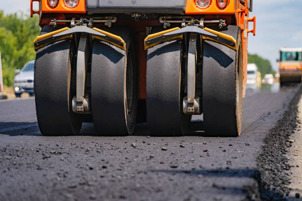 istock Close view on the road roller working on the new road construction site. 1201723266