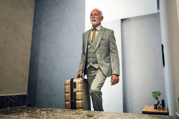 istock Senior businessman checking in hotel room 1201723984