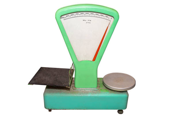 Classic, green weight scale, isolated on a white background with a clipping path.