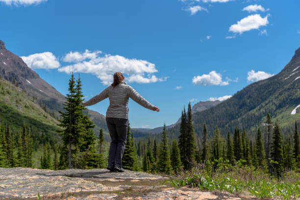 istock Woman Begins to Jump from Stone 1201725561