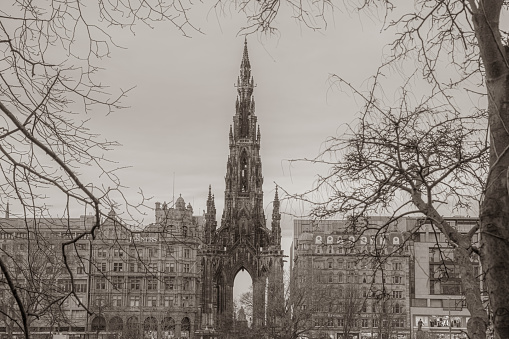 Edinburgh, Scotland, United Kingdom - January 18, 2020: View from Princes Street Gardens towards Princes Street and the Scott Monument.  The monument was constructed in 1846 to a design of George Kemp.